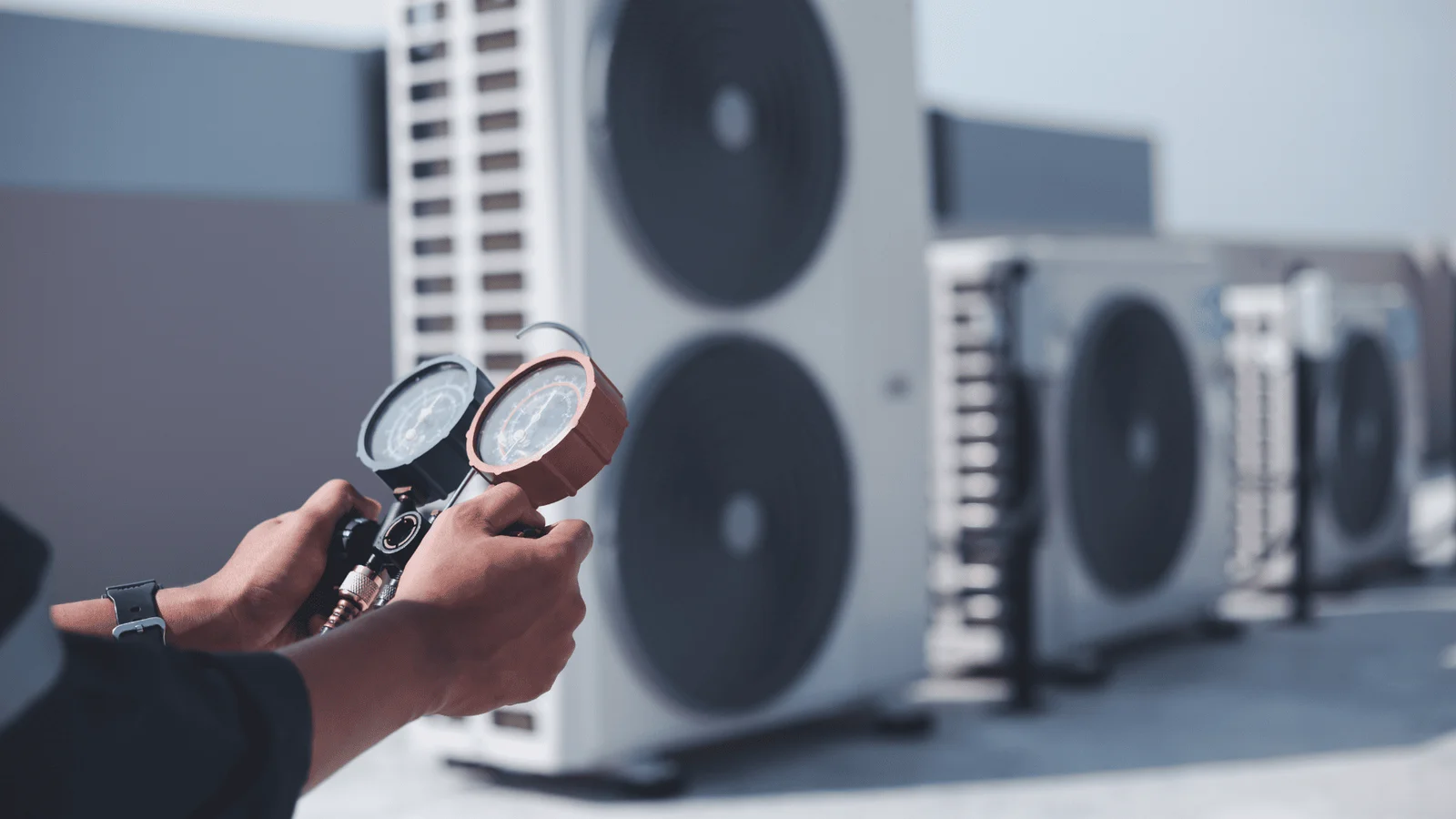 HVAC service technician working on an outdoor unit